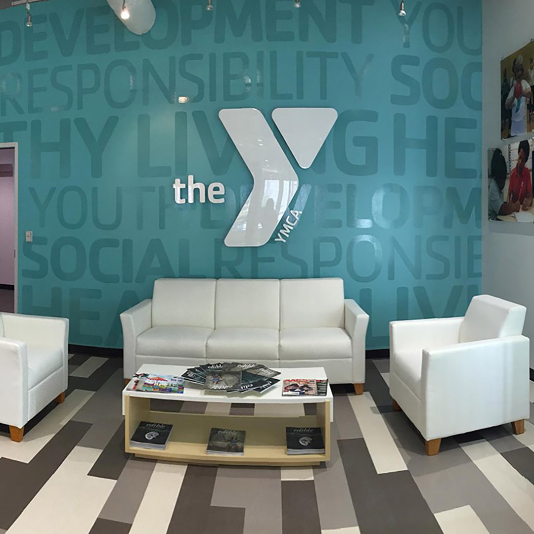 YMCA Lobby with large format wall wrap, vinyl lettering