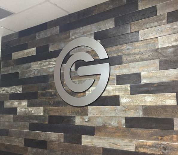 Silver routed logo sign for Excel Church interior design